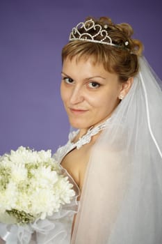 Portrait of a bride with a bouquet of white flowers