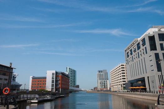 Modern Apartments around a Dock in an English City under a blue sky