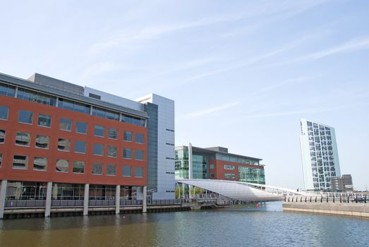 A Dockside Redevelopment showing modern offices and a modern white footbridge