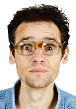 The amusing tousled man in old ridiculous spectacles isolated on white