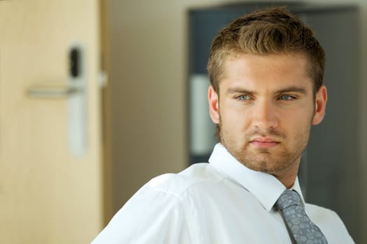 portrait of young confident caucasian businessman