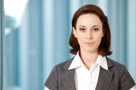 Portrait of young caucasian businesswoman in office