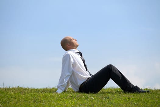 Businessman contemplating in park