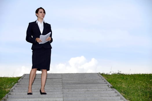 Businesswoman holding papers