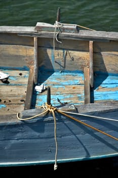 Old wooden boat detail with rope