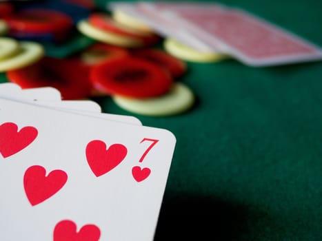 Cards and chips on green table