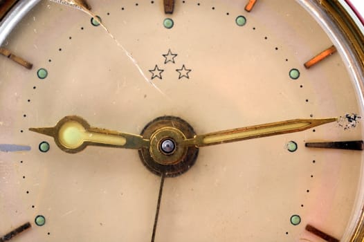 Close-up of an old and cracked clock