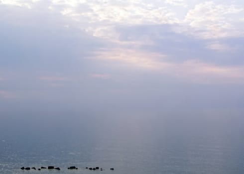 Mystic seascape with clouds and rocks