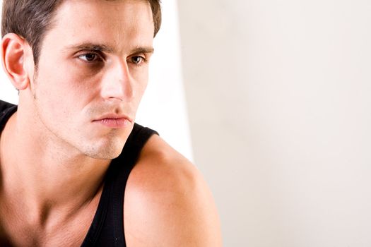 Young man portrait in the studio on a white background