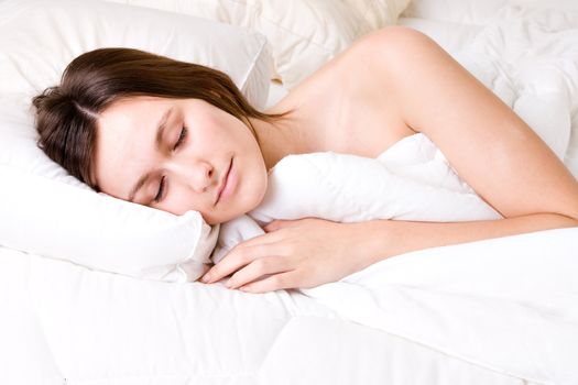 Young awe woman in sleeping in a bed