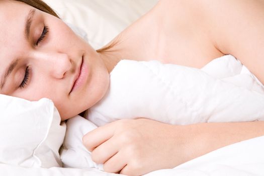 Young awe woman in sleeping in a bed