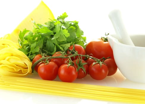 fresh ripe tomatos with parsley, cheese and pasta over white background