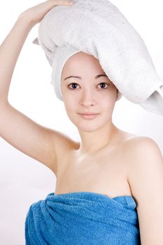 Young woman looking with a towel on her head