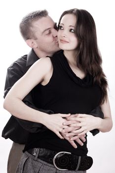 Studio shot of you loving couple kissing