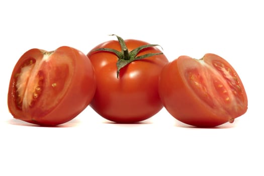 close view detail of a bunch of  red tomatoes isolated on a white background.