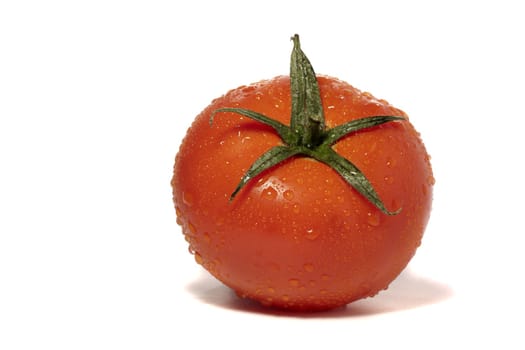 close view detail of a red tomatoe isolated on a white background.