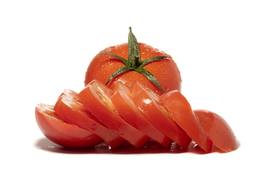 close view detail of a bunch of red tomatoes isolated on a white background.