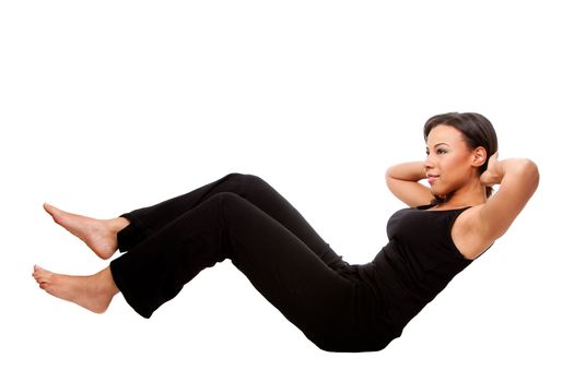 Young happy beautiful woman during fitness time exercising for health  staying in shape doing crunches situps, in black, isolated.