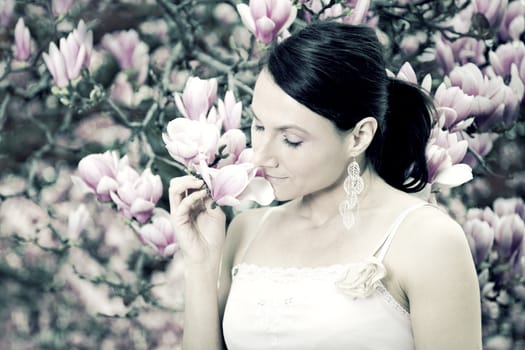 Girl and Magnolia flowers - spring time.