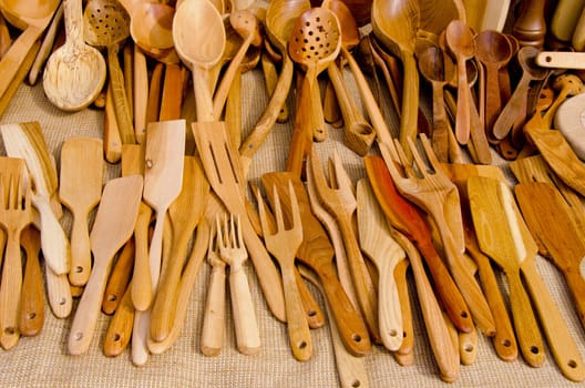 Fair sold a lot of hand-graven scoop, spoons, forks, slotted spoon and other wooden tools.