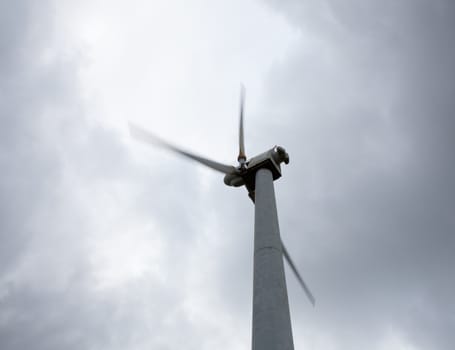 Wind turbine in wind farm on cloudy day in North Wales