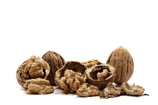 close view detail of  some walnuts  isolated on a white background.