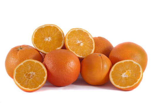 Detail view of a bunch of oranges isolated on a white background.