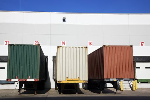 Colorful Trailers in front of the warehouse.