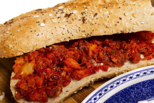 View of a dish of fresh sandwich with seeds filled with Portuguese chorizo.