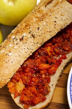 View of a dish of fresh sandwich with seeds filled with Portuguese chorizo.