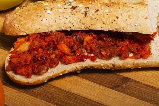 View of a dish of fresh sandwich with seeds filled with Portuguese chorizo.