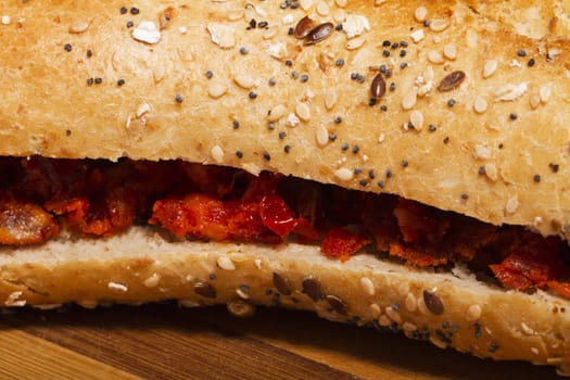 View of a dish of fresh sandwich with seeds filled with Portuguese chorizo.