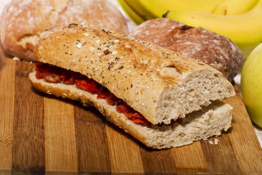 View of a dish of fresh sandwich with seeds filled with Portuguese chorizo.