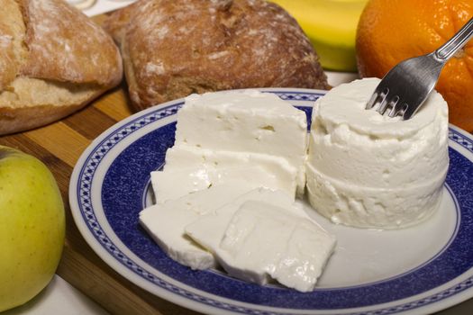 View of a dish of fresh cheese on a plate.