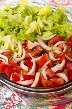 Close up view of the typical Mediterranean Portuguese salad with tomato and lettuce. 