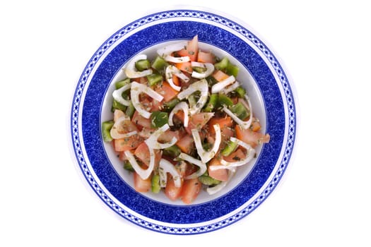 Detail view of a fresh made Mediterranean salad isolated on a white background.