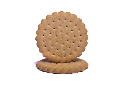 View of two round biscuits isolated on a white background.