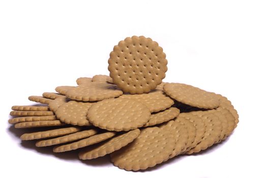 View of many round biscuits isolated on a white background.
