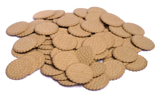 View of many round biscuits isolated on a white background.