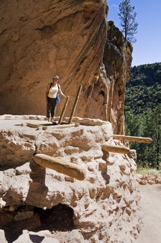 Tourist on Kiva - El Malpais National Monument; New Mexico.
