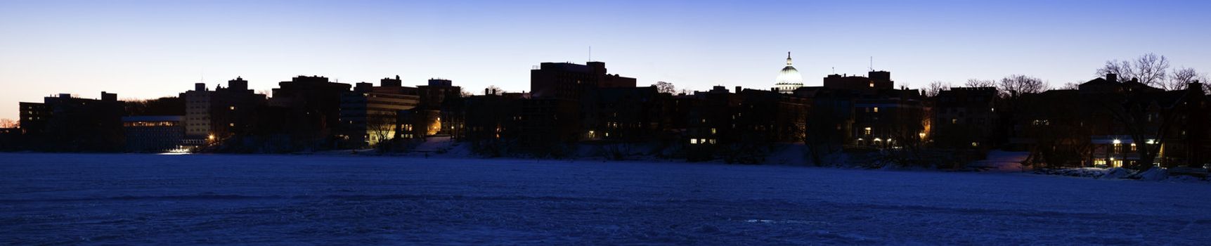 Downtown Madison seen from Frozen Lake Mendota before sunrise.