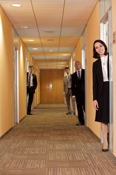 Business people standing in corridor