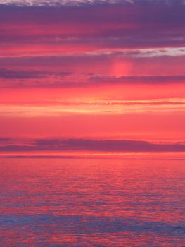 Beautiful pink colors reflect off Lake Superior in northern Michigan.