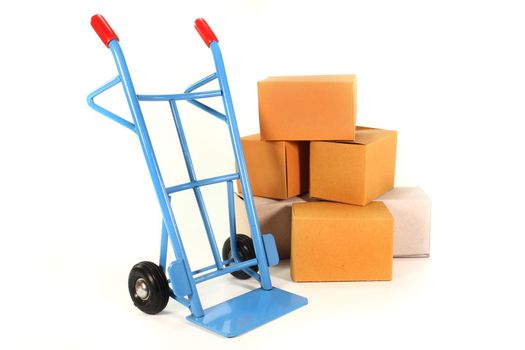 a sack truck and packing boxes on a white background