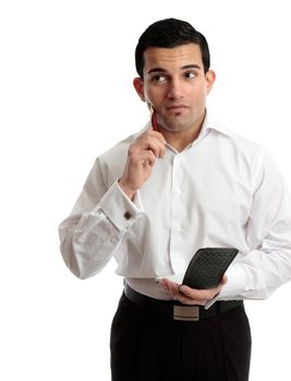 A businessman with hand and pen to chin in a thinking pondering expression.