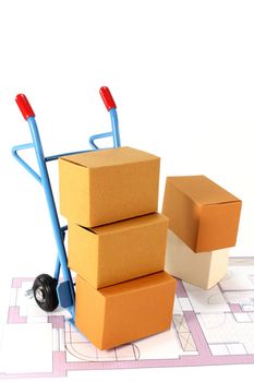 a sack truck and packing boxes on a white background