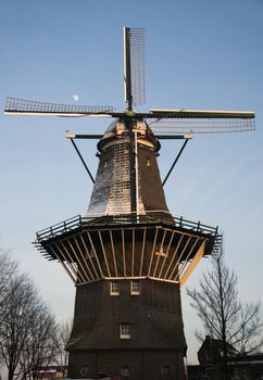 Windmill in downtown of Amsterdam. Brewery inside.