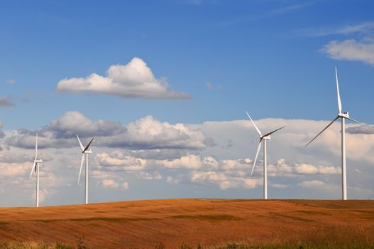 Large wind turbines gathering electricity out of the wind in eastern Colorado, USA