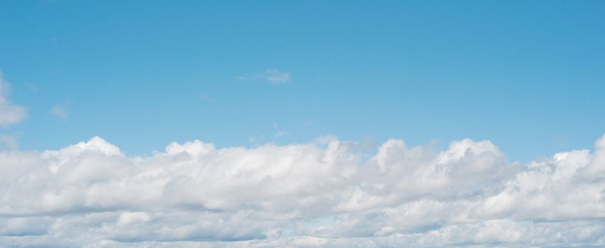 panorama of fluffy white heavenly clouds with copyspace