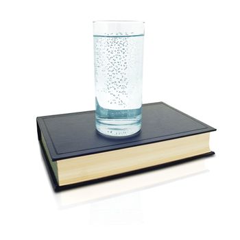 a glass full of water with letters and some hidden words on the book